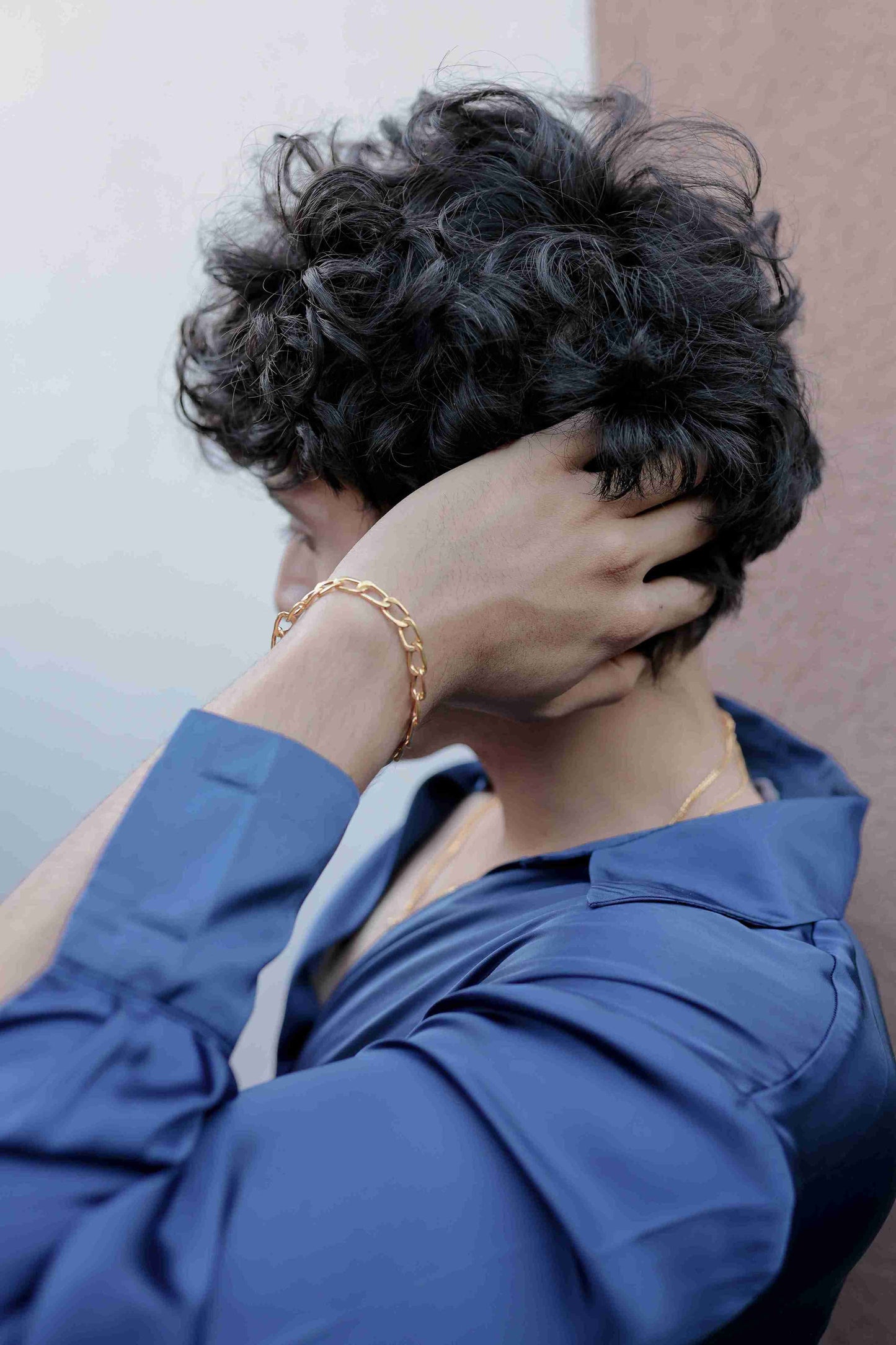 Sleek gold chain bracelet for men with a classic design. The image showcases the intricate links and the bracelet's smooth,