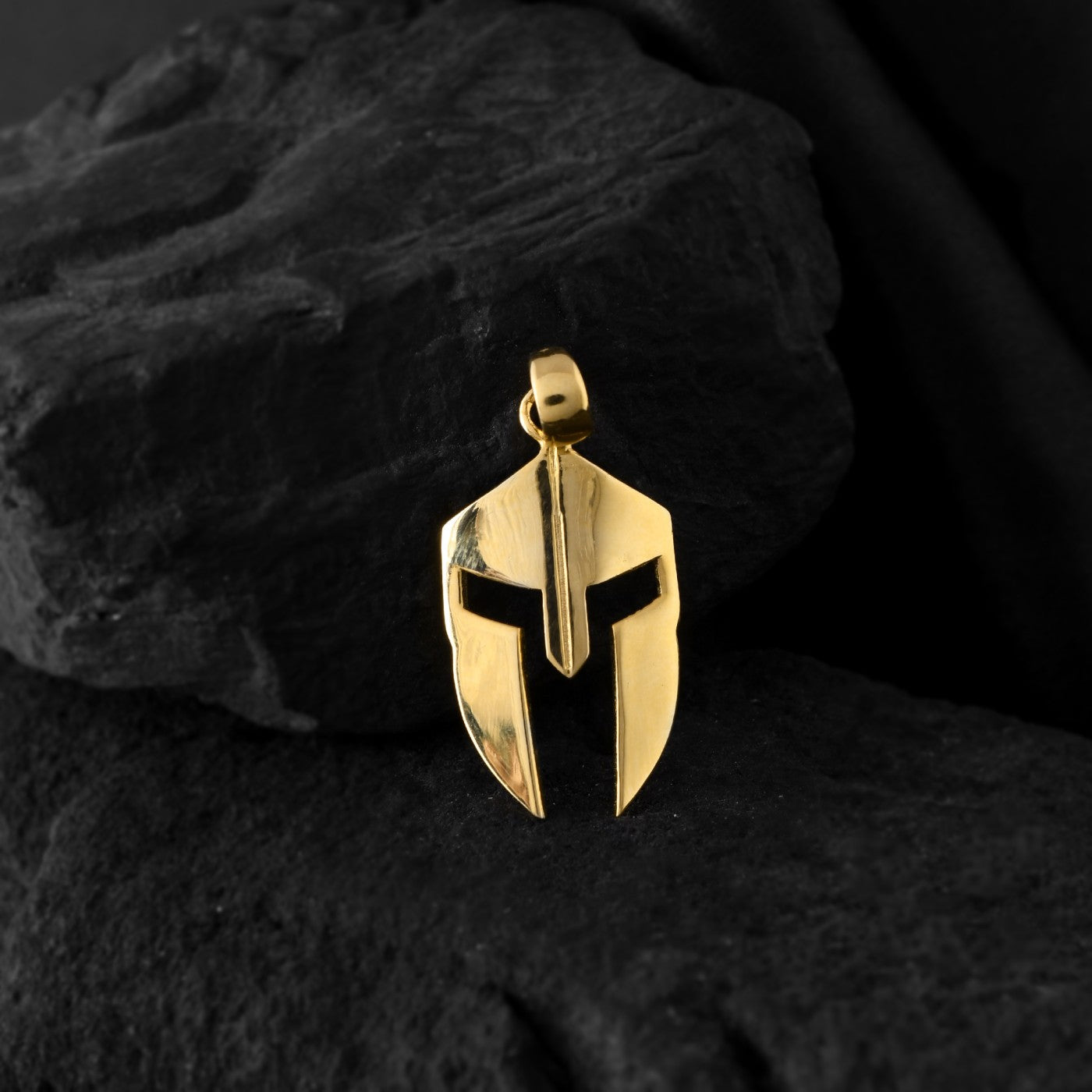 A detailed Spartan helmet pendant crafted from gold, The timeless design makes it a versatile neck accessory for men or boy.