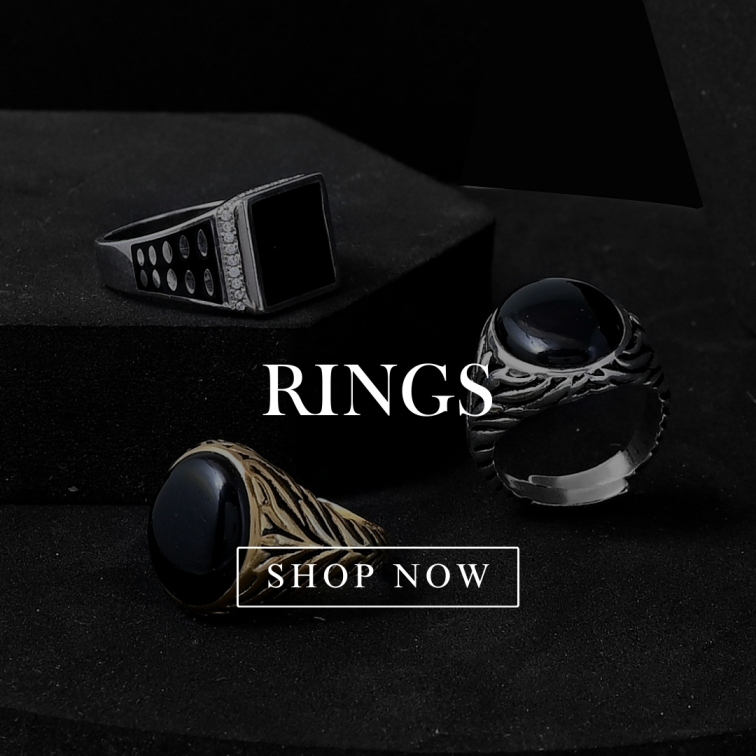 Gold plated, black stone and pure silver rings arranged for a captivating display, this gents ring offers timeless elegance