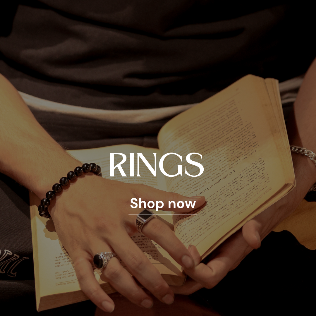 Gold plated, black stone and pure silver rings arranged for a captivating display, this gents ring offers timeless elegance