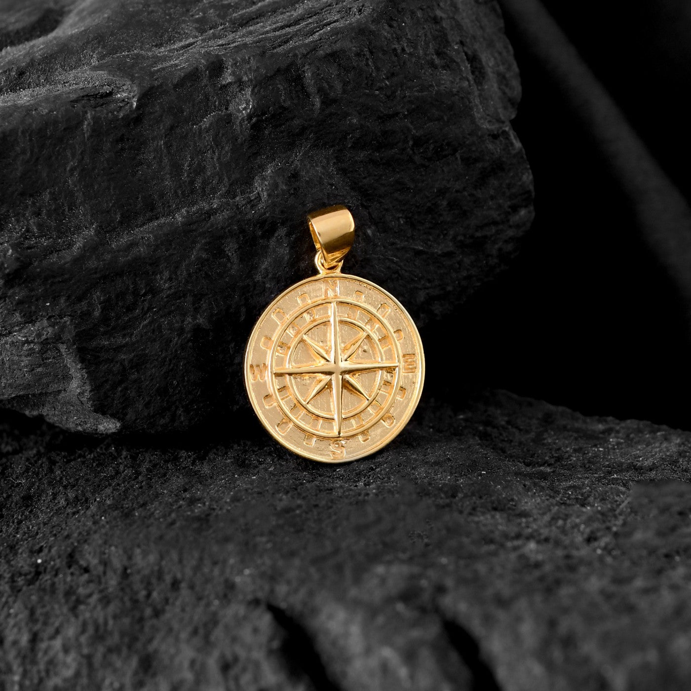 Gleaming gold compass pendant for men evokes a sense of wanderlust and the thrill of exploration.