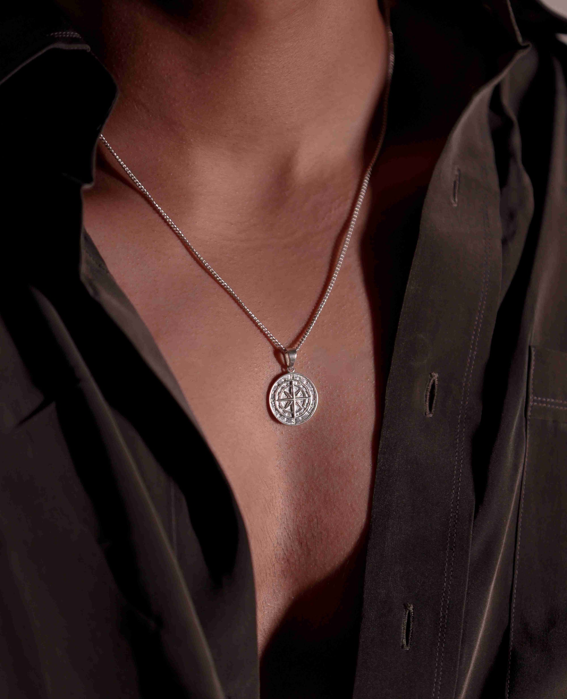 lost? Never again! This silver compass pendant, a symbol of direction and journey, keeps you on track towards your goals.