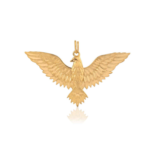 a gold eagle pendant for men with a hooked beak and grasping talons. The detailed bird hangs from a chain on a white backdrop.