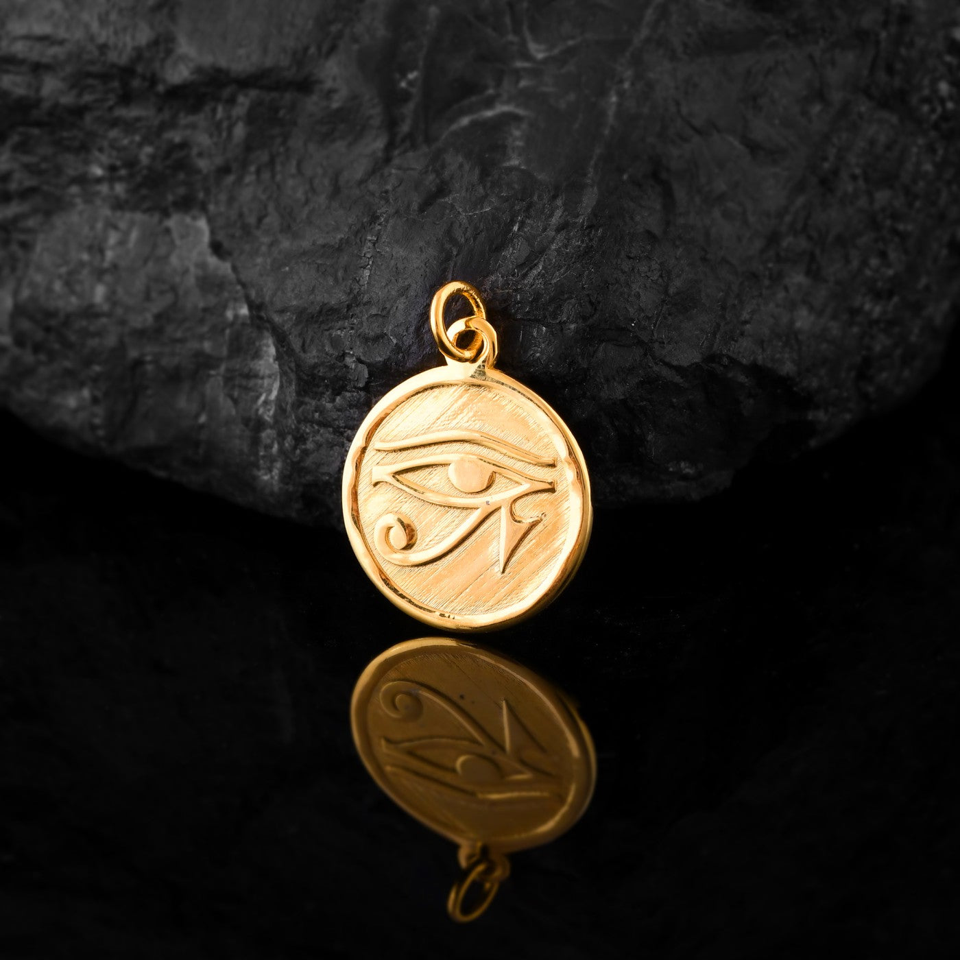 This gold pendant for men depicts the Eye of Horus, a watchful symbol from Egyptian mythology believed to bring good health, wisdom, and ward off evil.