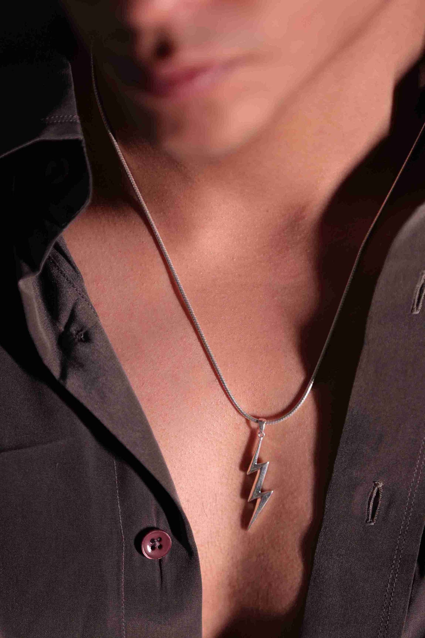 A 925 sterling silver lightning bolt streaks across your chest, The timeless design makes it a versatile neck accessory for men or boy.