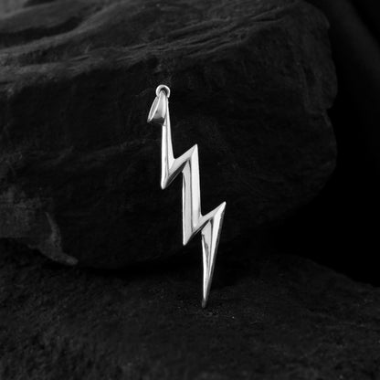 Minimalist lightning strikes! A sleek pure silver bolt pendant captures the essence of raw energy. This modern symbol adds a touch of edge to any look