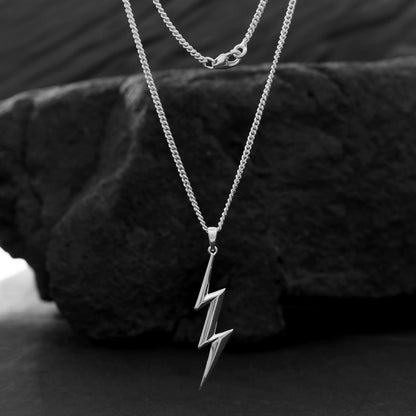 Spark something with this silver lightning bolt pendant. The bold charm on a thin silver chain evokes energy, individuality, and a connection to the power of nature.