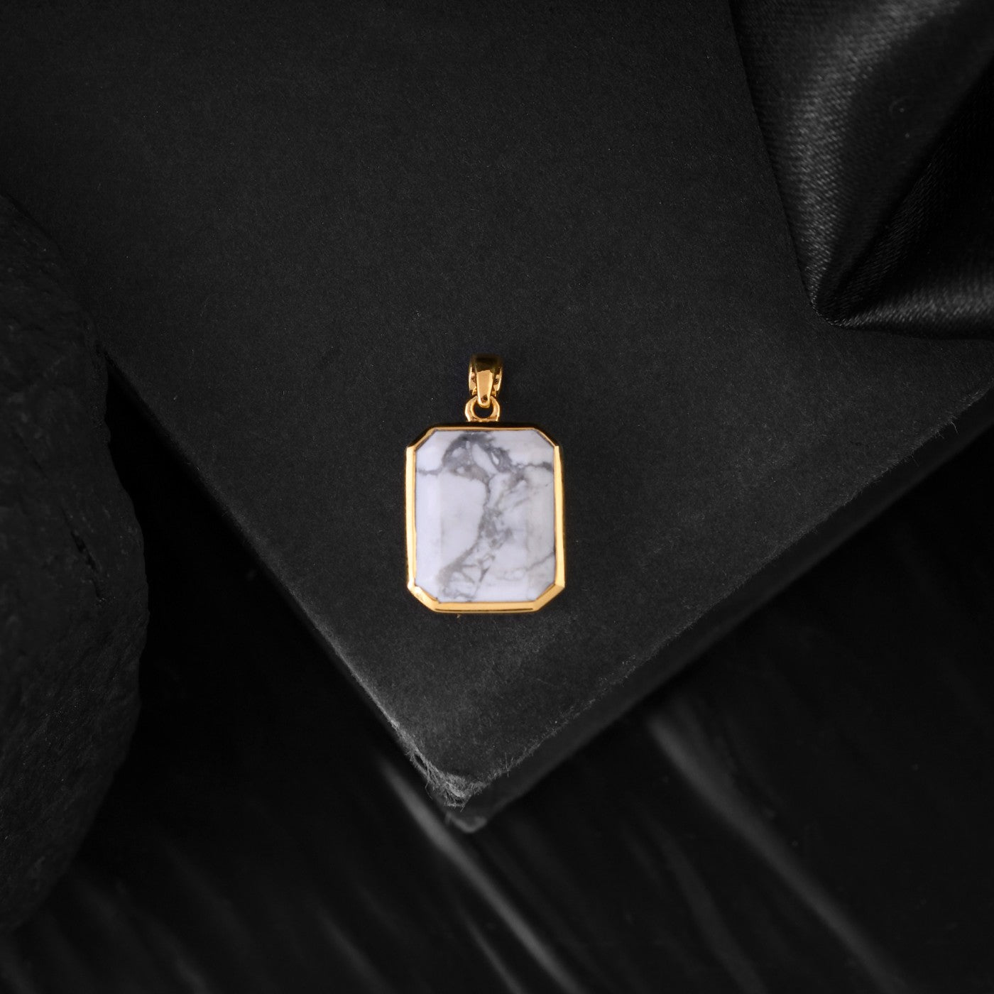 This unique gold pendant design for men features a howlite stone ,A perfect gift for the man who appreciates understated elegance.