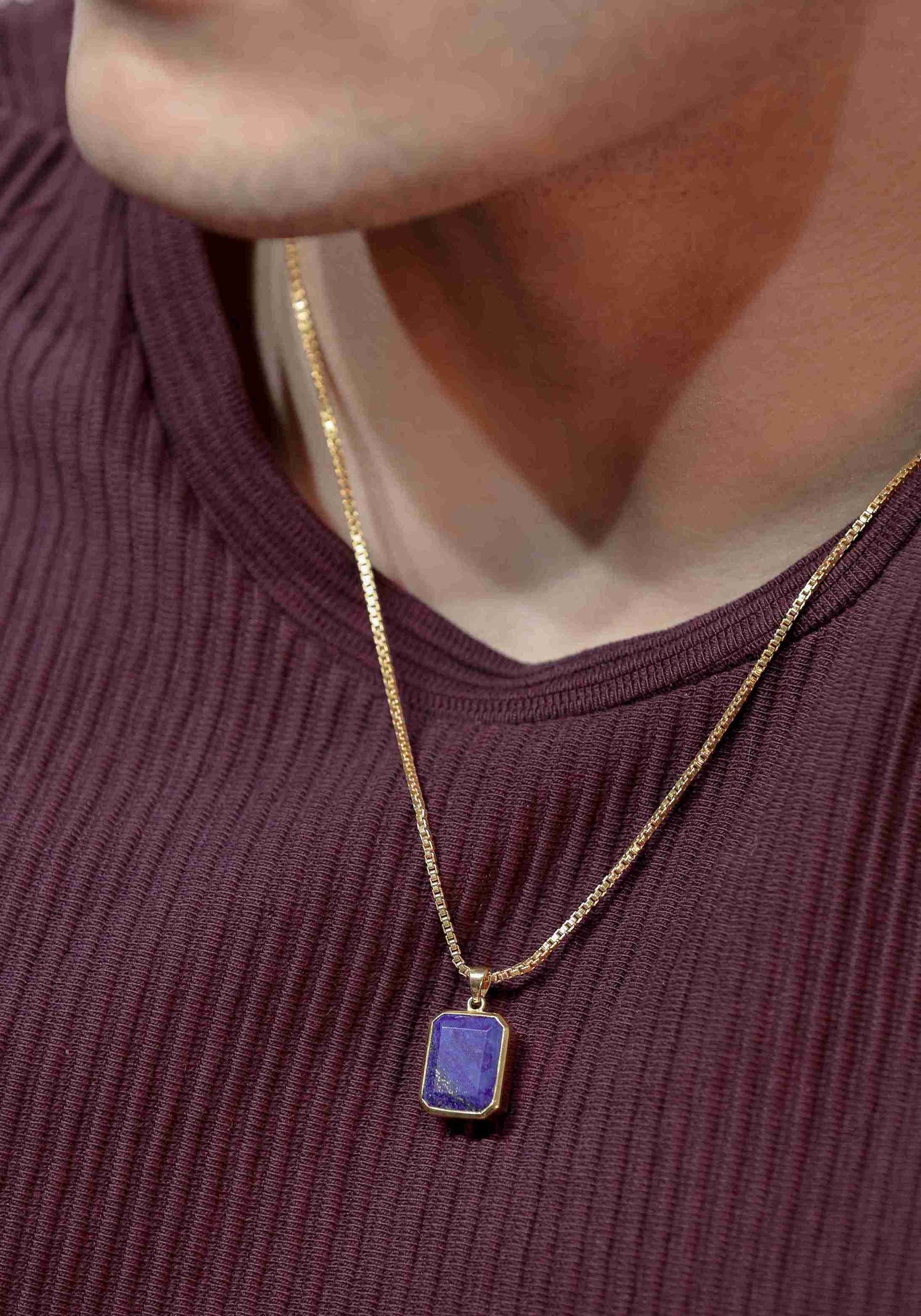 Gold pendant for men adorned with a vibrant blue gemstone. The classic design makes it a timeless piece of gold jewelry.