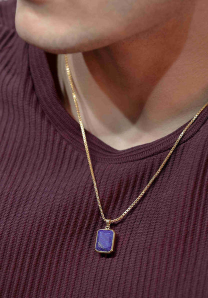 Gold pendant for men adorned with a vibrant blue gemstone. The classic design makes it a timeless piece of gold jewelry.