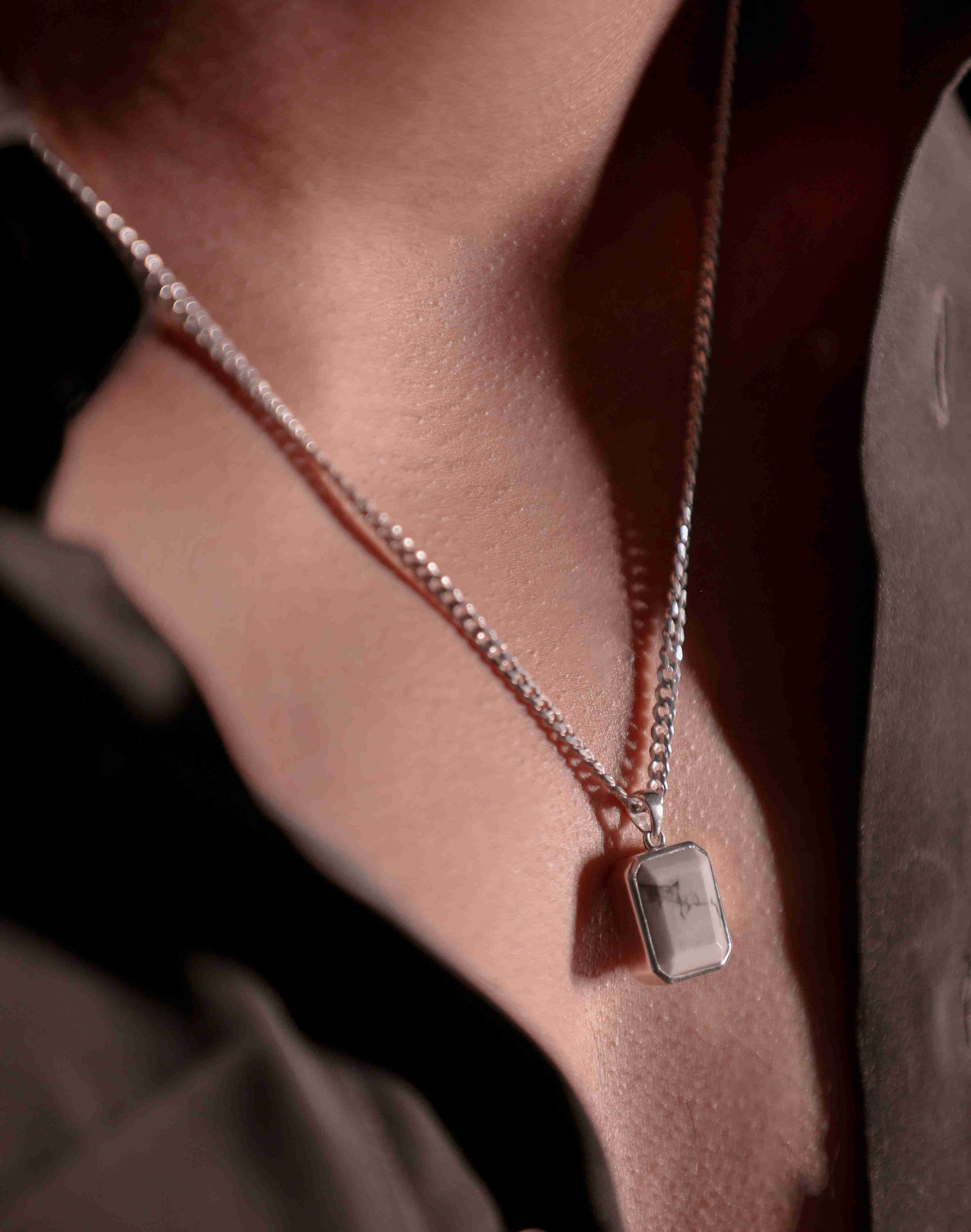 925 Sterling silver pendant with a sparkling howlite stone. The timeless design makes it a versatile neck accessory for men or boy