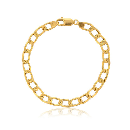 A close-up photo of a gold chain bracelet with a shiny finish. The bracelet is laying flat on a white background, and it casts a faint reflection. This type of bracelet is sometimes called a Figaro bracelet.