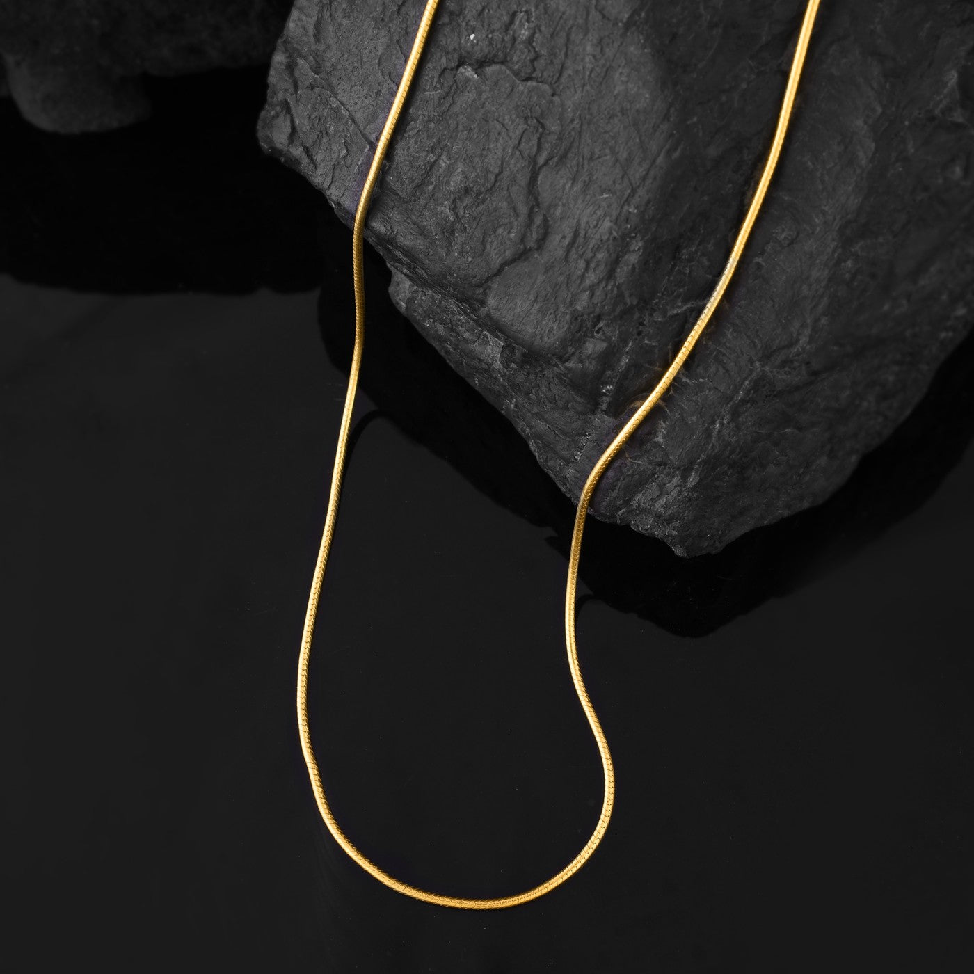 This close-up view highlights a gold snake chain necklace, Elevate Your Look with this Gold Jewellery for Men