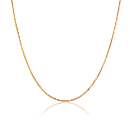 This image showcases a gold snake chain necklace for men, its intricate links catching the light against a crisp white backdrop. 