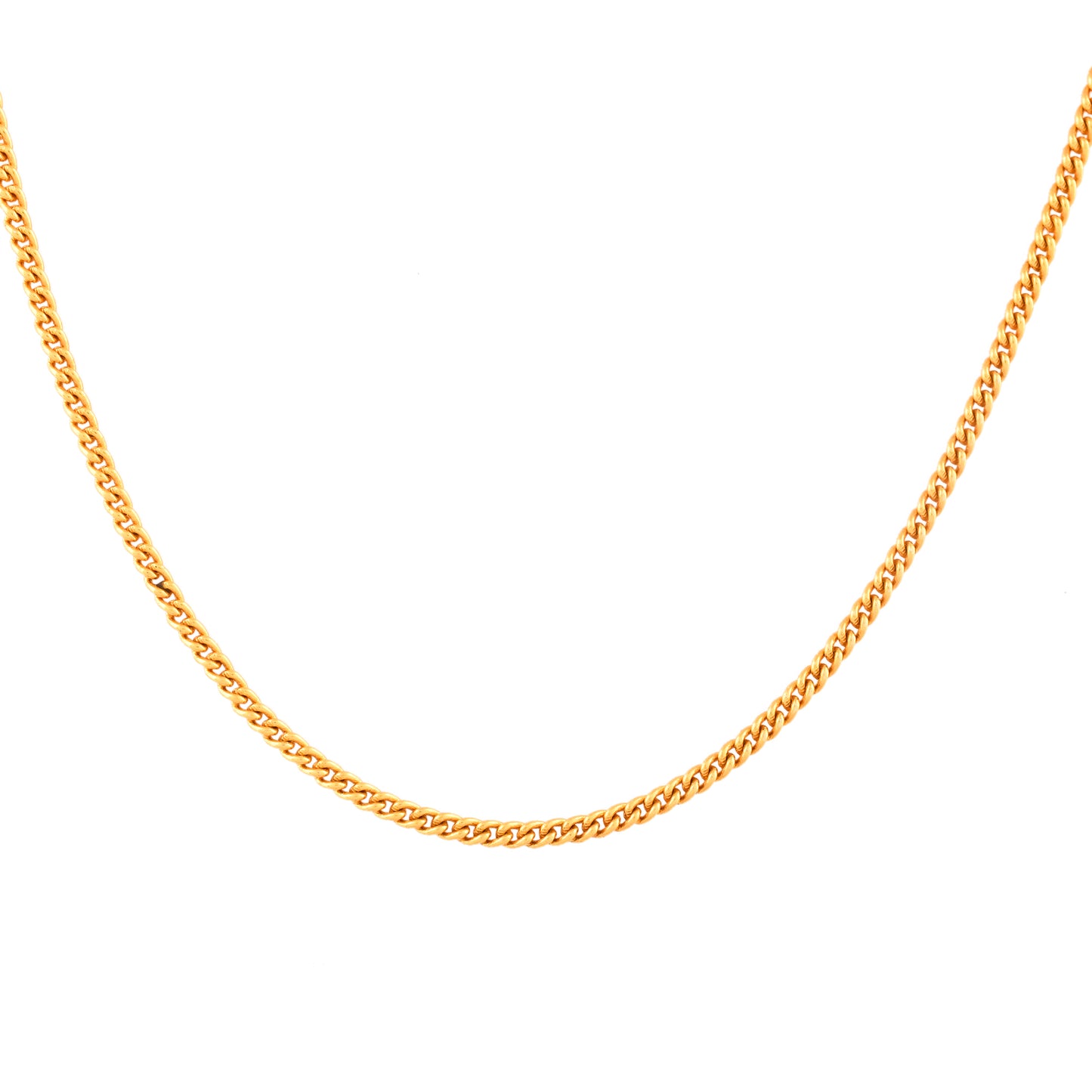 Close-up of a gold plated silver link chain for men. The shiny links cast a soft reflection on a white surface.